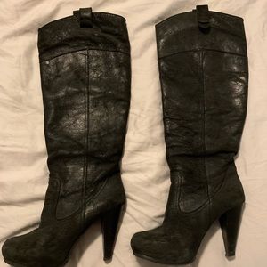 Black leather boots, below the knee